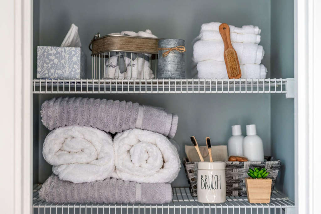 storing excess towels in bathroom